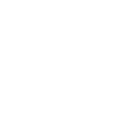 A cup with utensils inside of it on a green background